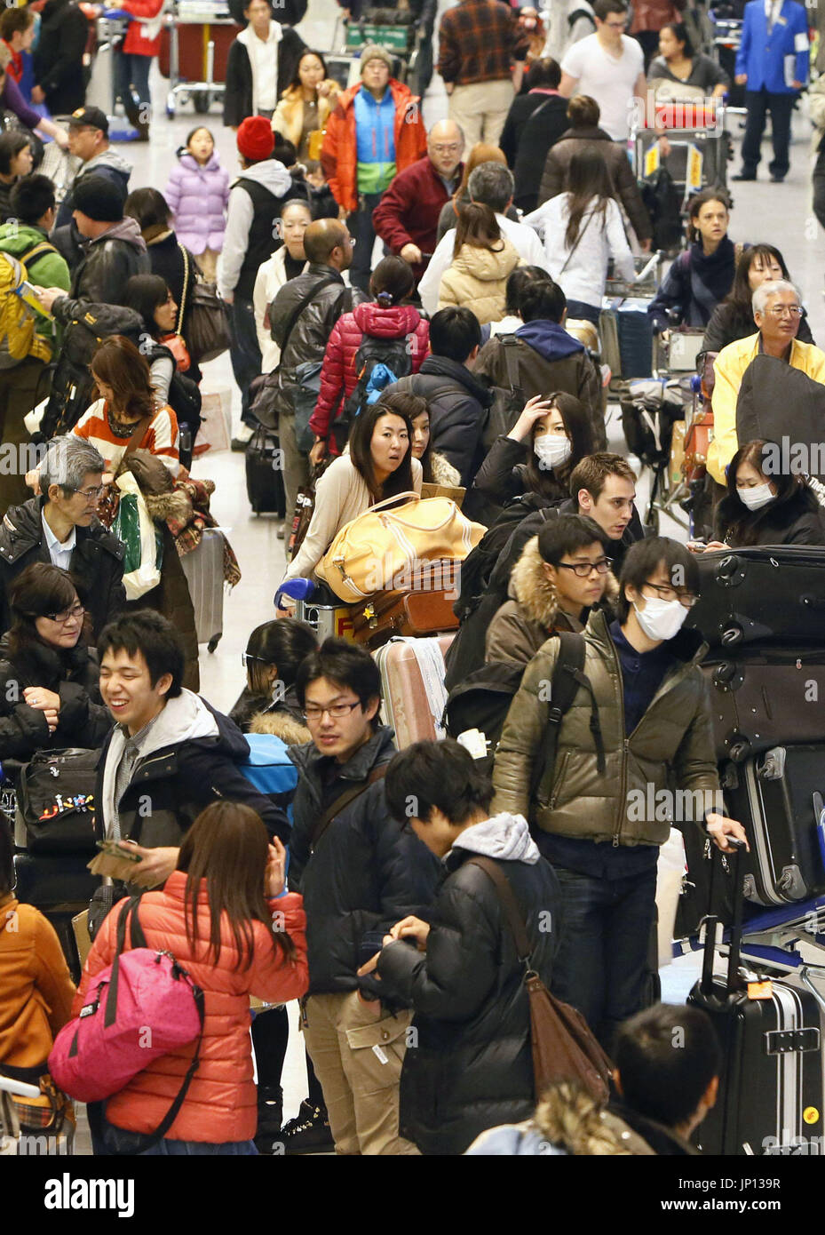 NARITA, Japan - Travelers arrive at Narita airport near Tokyo on Jan. 5 ...