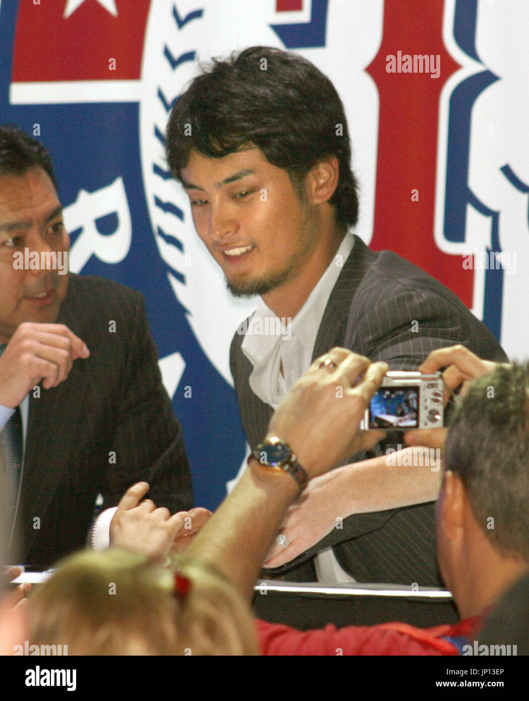 Texas Rangers right-hander Yu Darvish (L) chats with Nippon Ham Fighters  two-way player Shohei