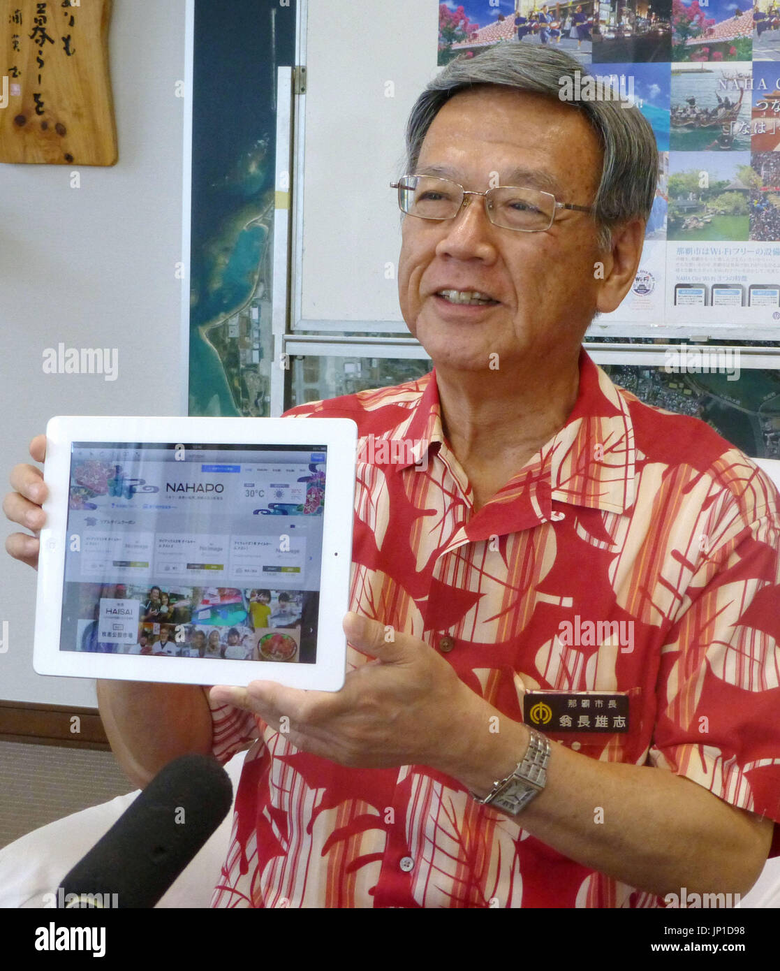 NAHA, Japan Naha Mayor Takeshi Onaga shows the city's soontobe