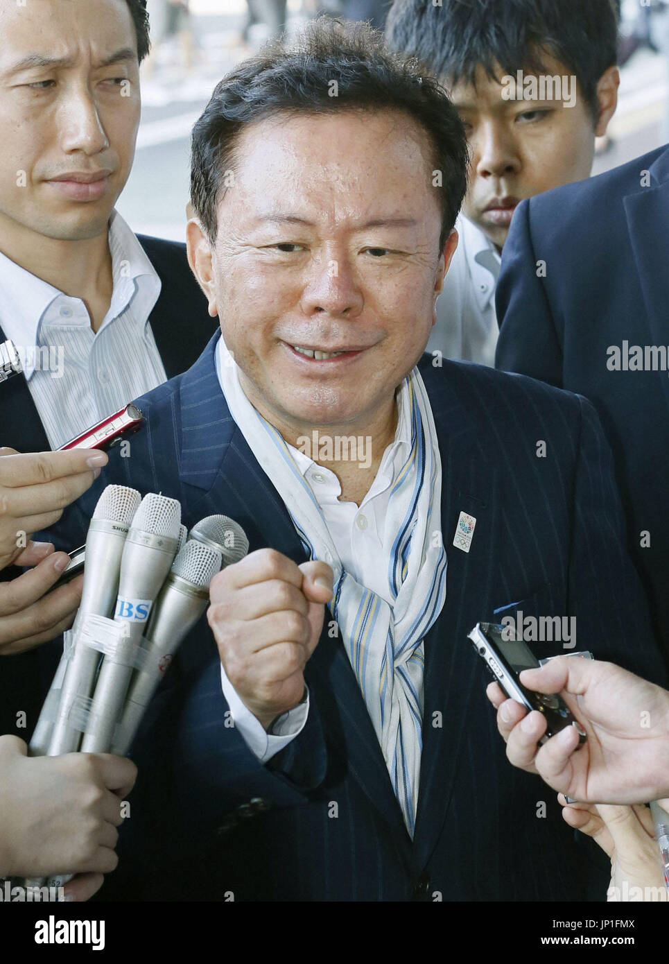 NARITA, Japan - Tokyo Gov. Naoki Inose clenches his fist before leaving ...