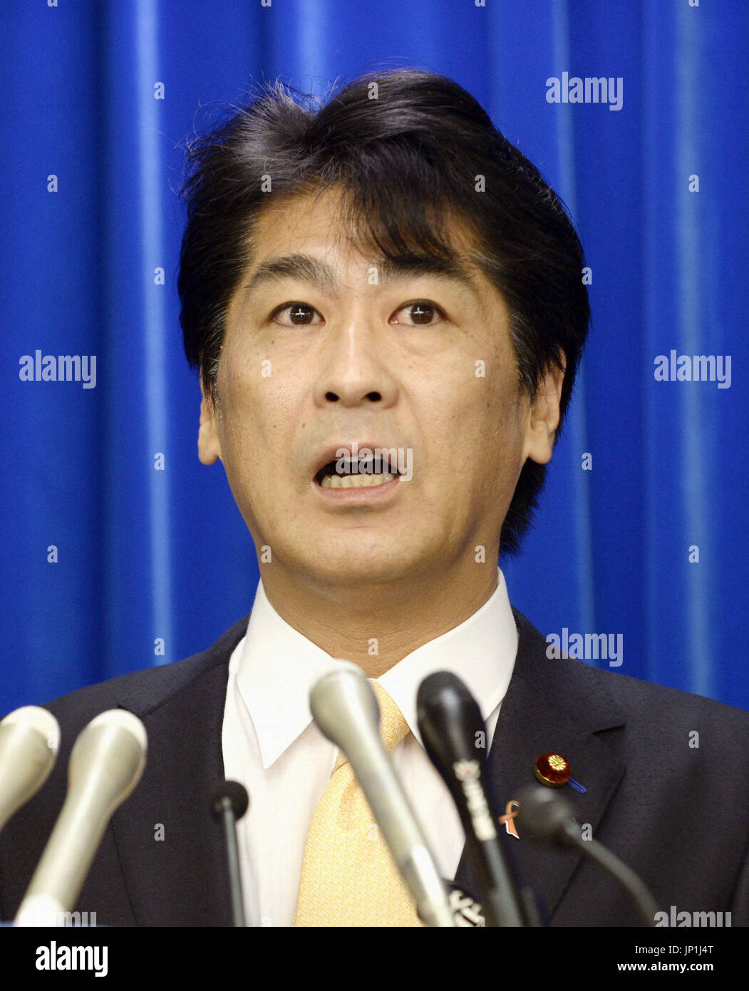 TOKYO, Japan Health, Labor and Welfare Minister Norihisa Tamura holds