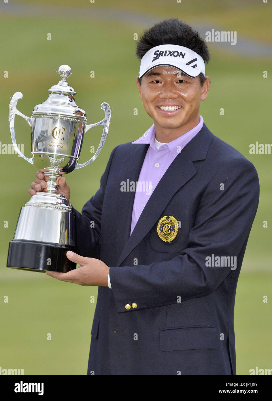 MIHO, Japan China's Wu Ashun holds the victor's trophy after winning