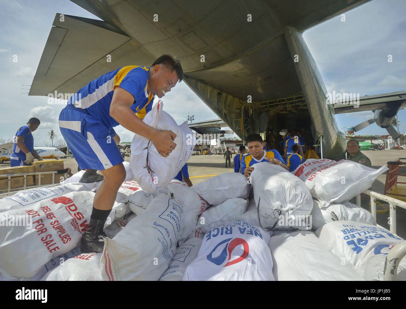 Tacloban Philippines Rescue Supplies Are Unloaded From An Air Force