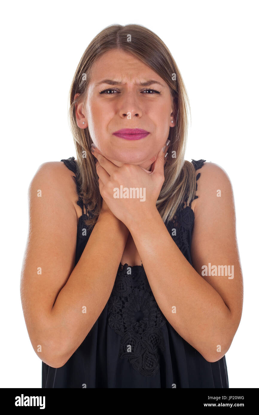 Picture of young woman having sore throat holding her neck, checking the inflamed glands - isolated background Stock Photo