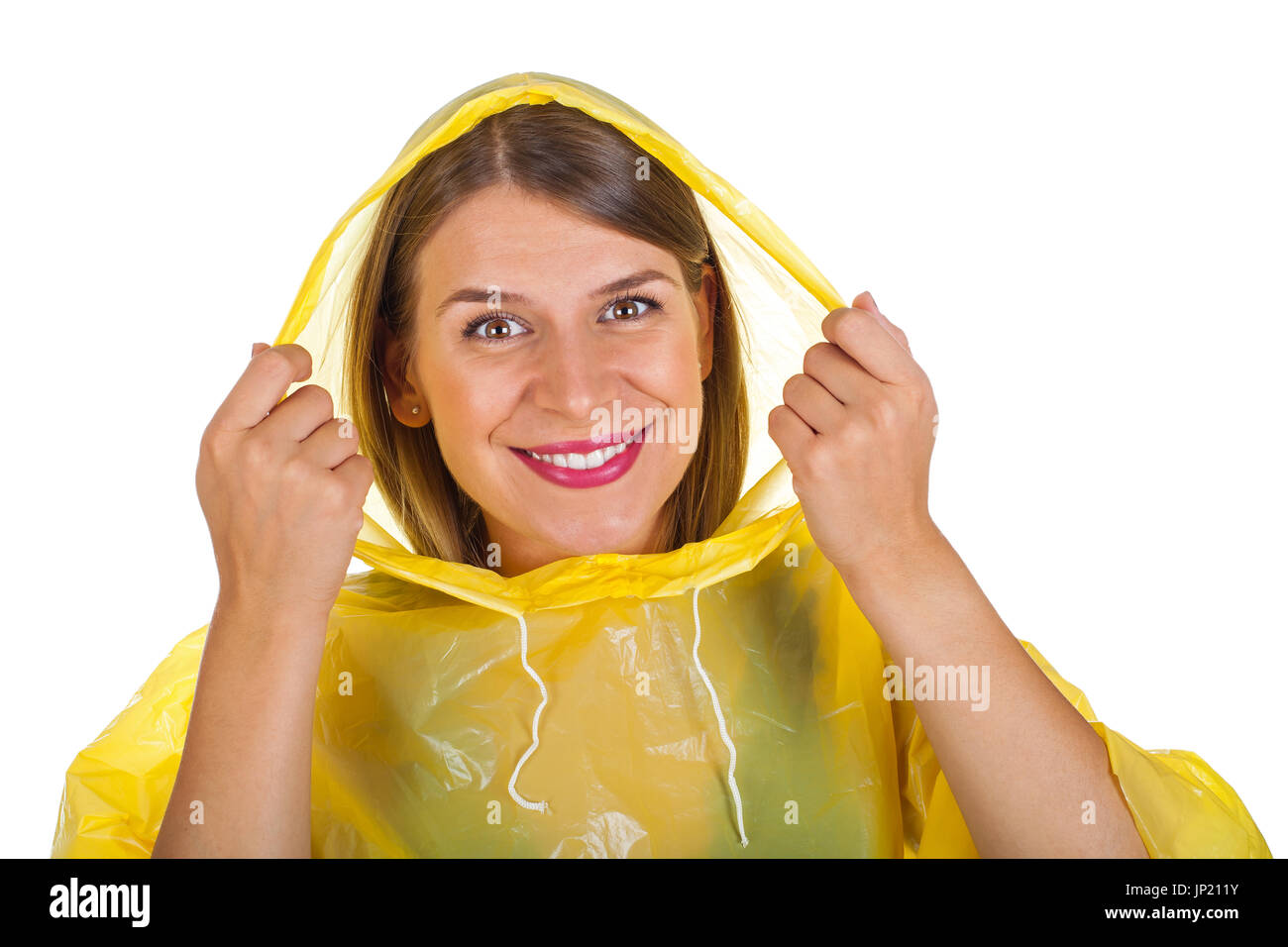 Studio portrait of a young woman with yellow coat hi-res stock ...