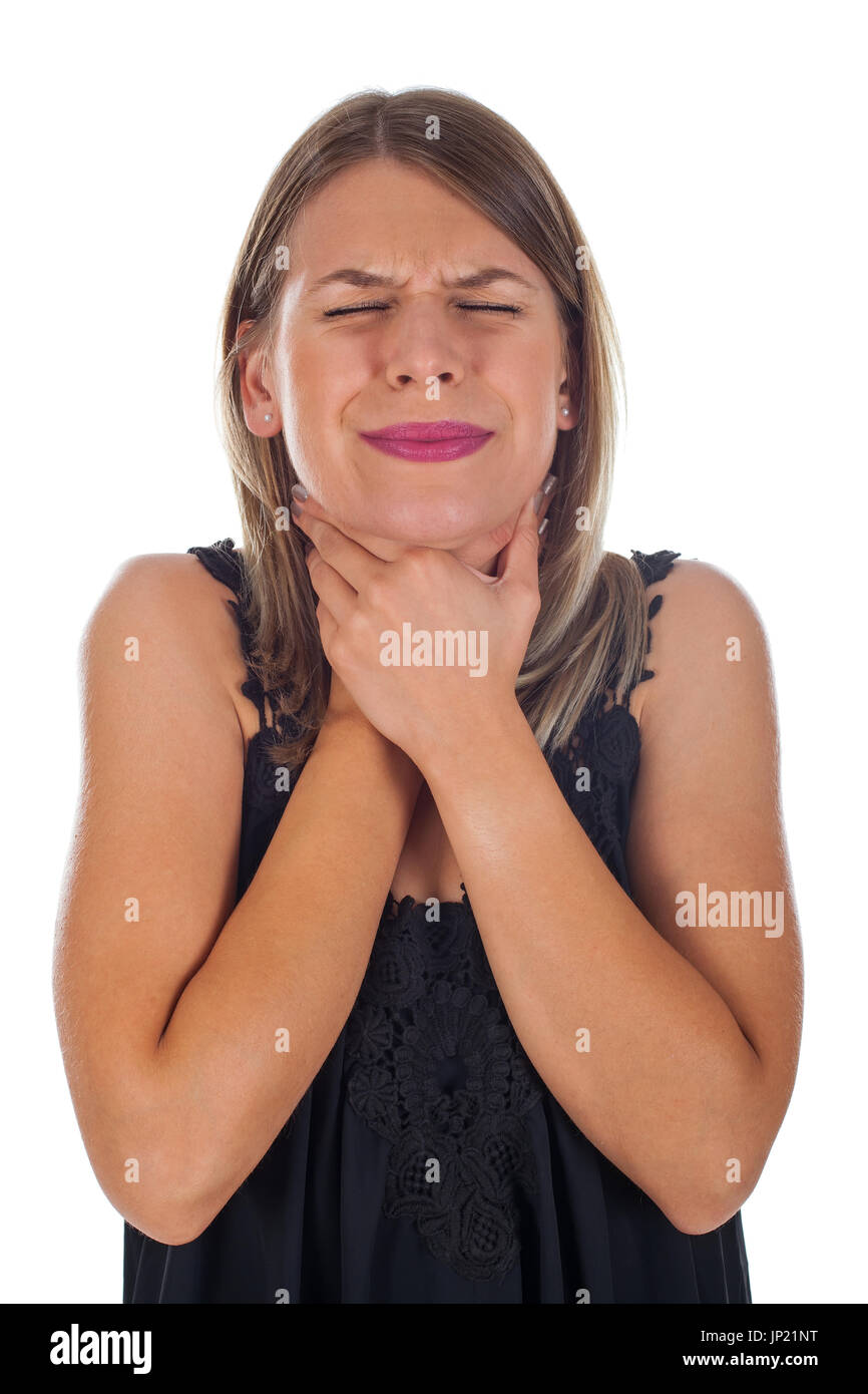 Picture of young woman having sore throat holding her neck, checking the inflamed glands - isolated background Stock Photo