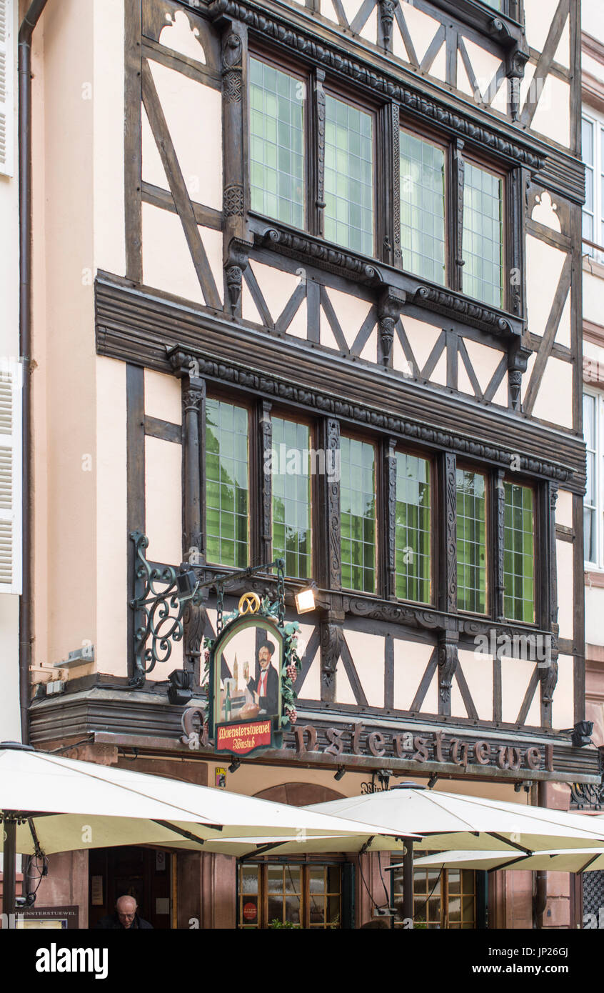 Strasbourg, Alsace, France - May 3, 2014: Half timbered Muensterstuewel winstubb (eatery and bar) in central Strasbourg, Alsace, France Stock Photo