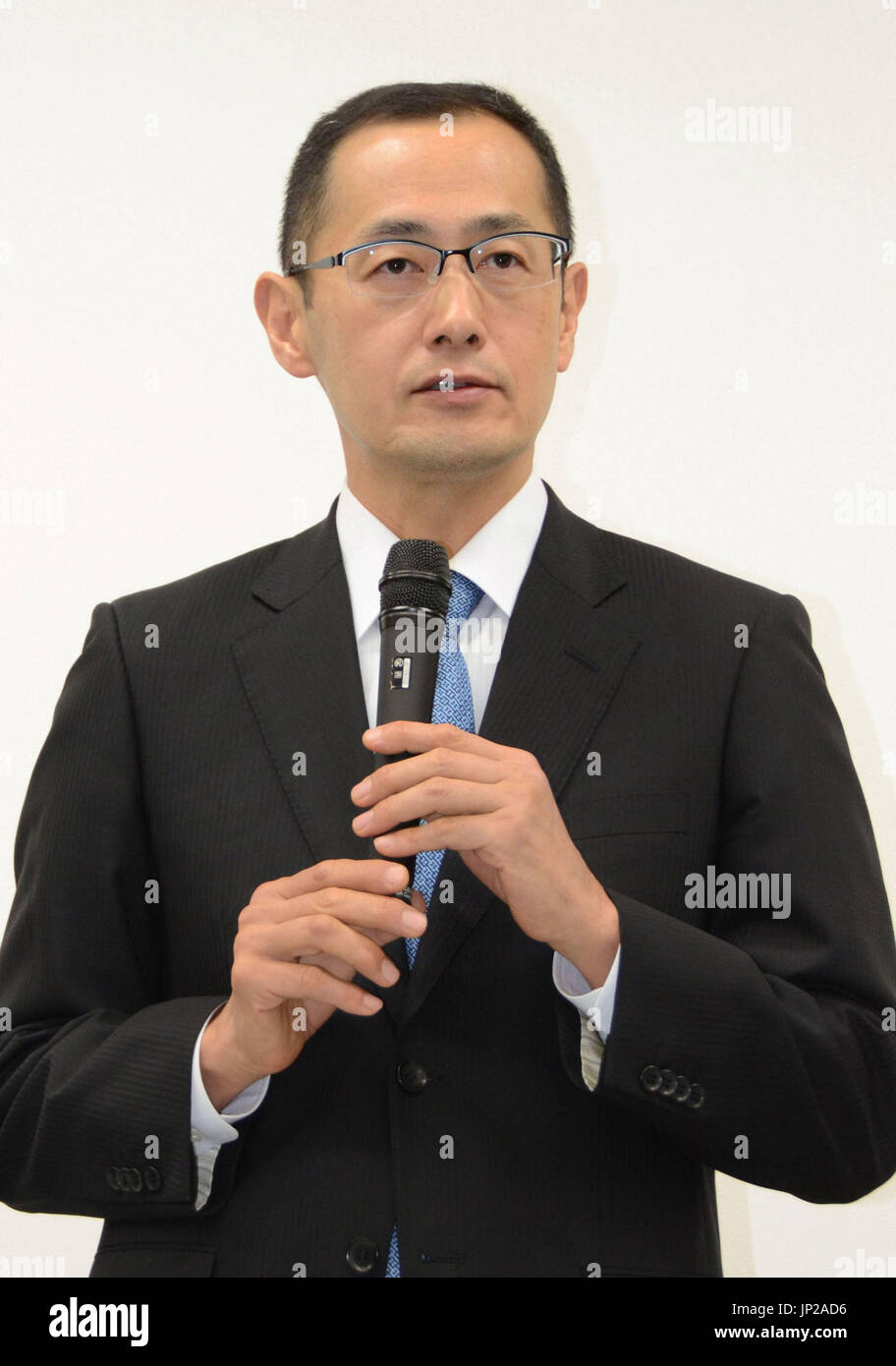 KYOTO, Japan - Shinya Yamanaka, who heads Kyoto University's Center for iPS Cell Research and Application, holds a press conference at the university in Kyoto on March 1, 2014, following revelations that the university's laboratory conducting experiments on induced pluripotent stem cells has been warned by the science ministry about its careless control of genetically engineered mice. (Kyodo) Stock Photo