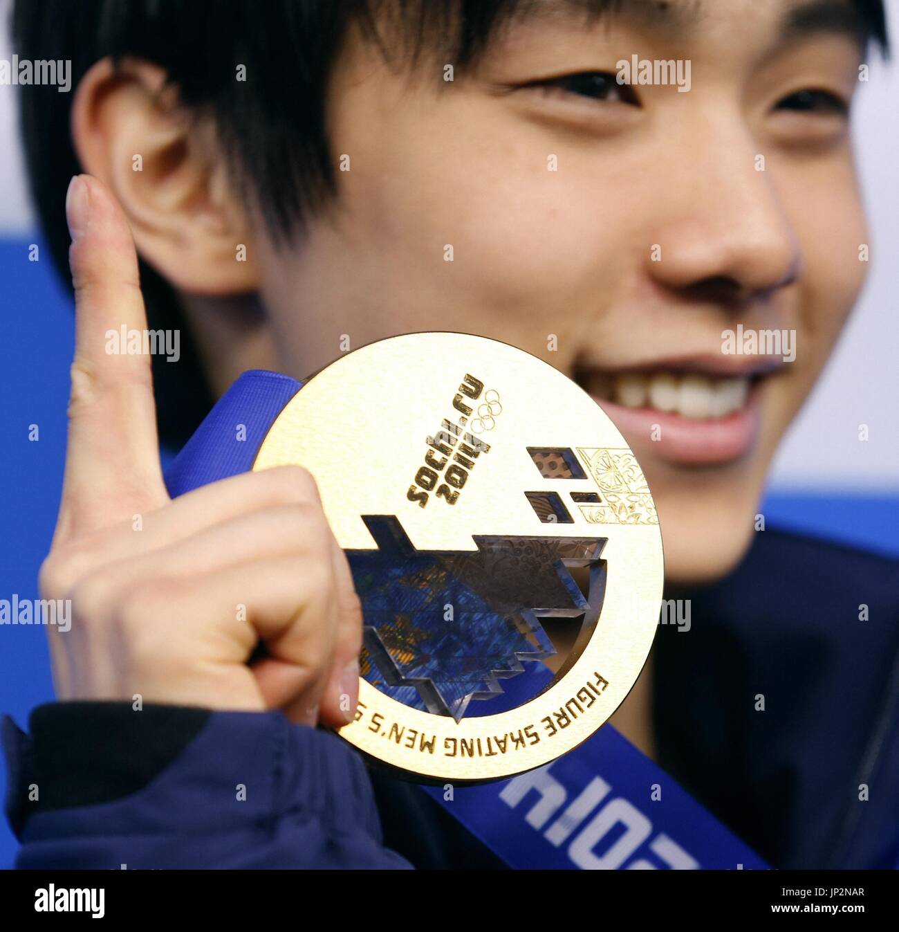 SOCHI, Russia Men's figure skating champion Yuzuru Hanyu holds his