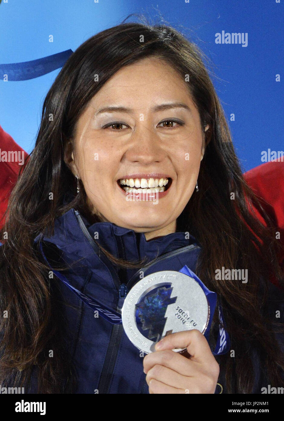 SOCHI, Russia - Tomoka Takeuchi of Japan smiles during an awards ceremony after winning the silver medal in the women's snowboard parallel giant slalom event at the Winter Olympics in Sochi, Russia, on Feb. 19, 2014. (Kyodo) Stock Photo