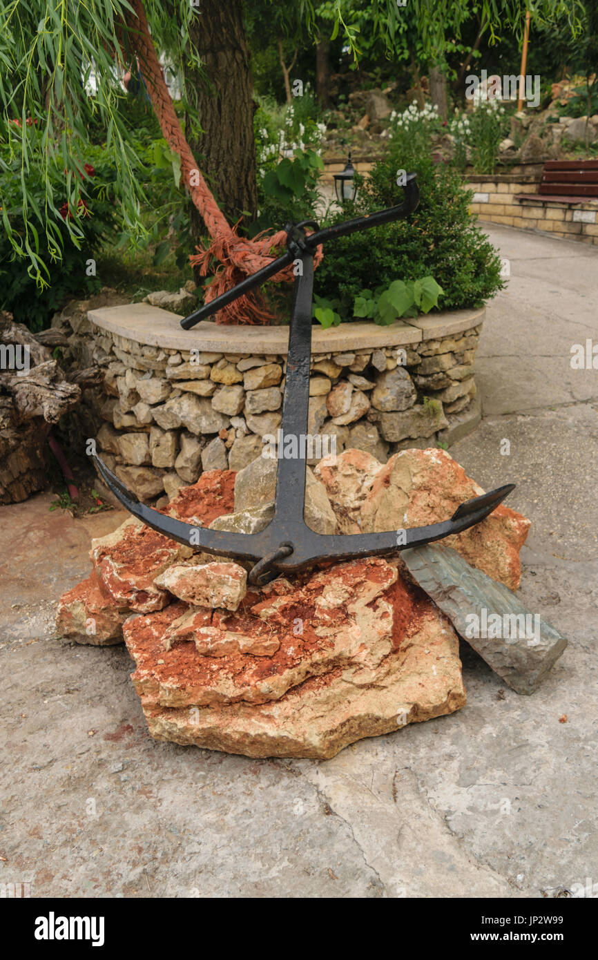 anchor on rocks for display purpose Stock Photo