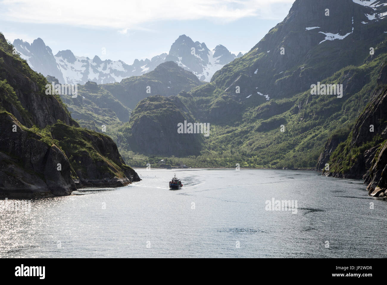 Steep sided glacial trough fiord jagged mountain peaks, Trollfjorden, Lofoten Islands, Nordland, northern, Norway Stock Photo