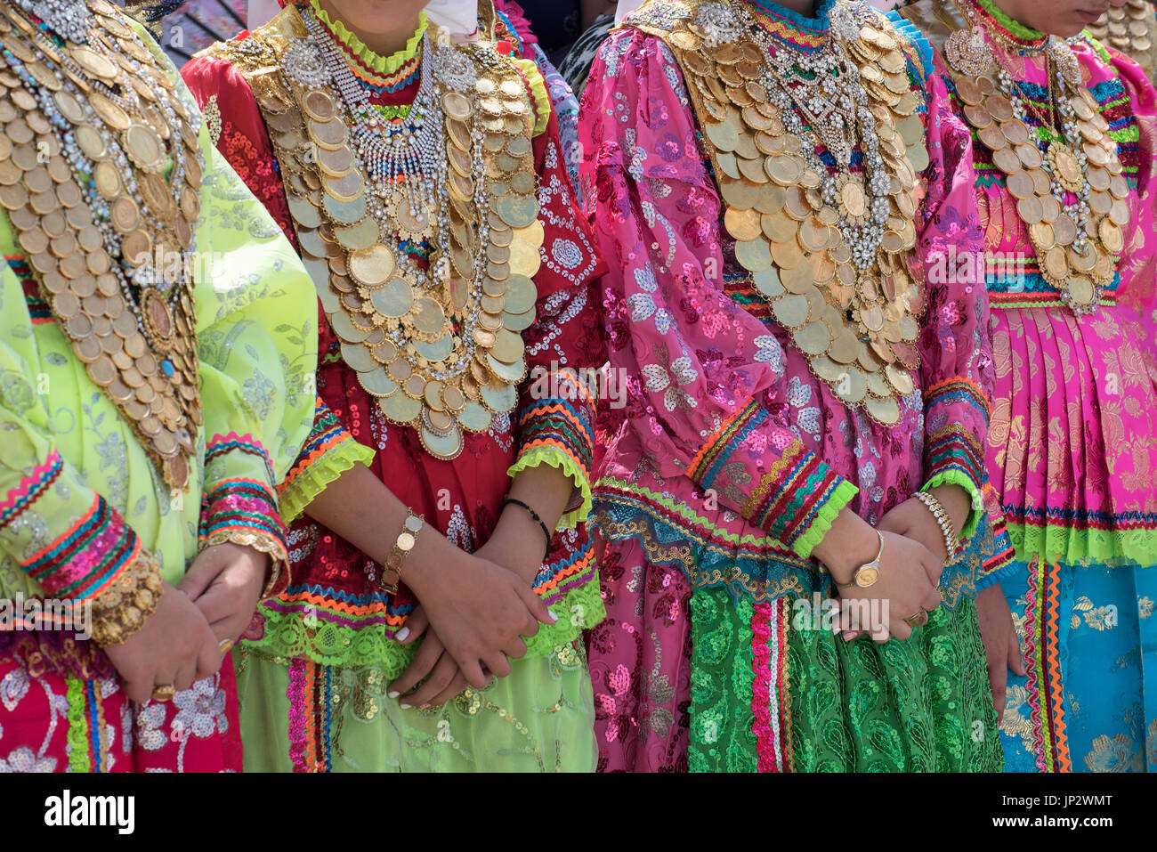 Dressed girls with gold coin necklaces, Assumption Day, Olympos, Karpathos Greece Stock Photo