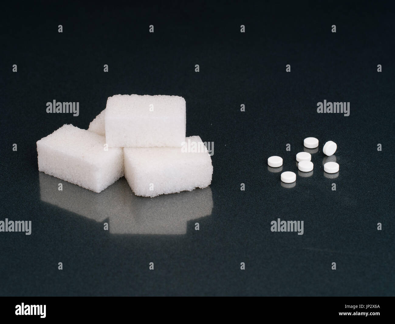 Sugar or aspartame to sweeten. Dietary decision. Stock Photo