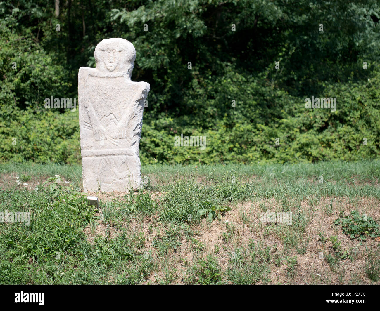 Statua stele. Replica. Example of ancient carved stones, typical of the area. Outside Pieve di Sorano church. Stock Photo