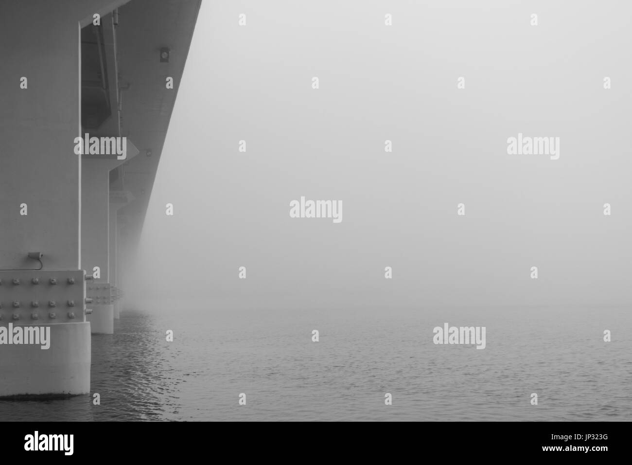 Bridge at Ria de Aveiro, on a foggy day. Stock Photo