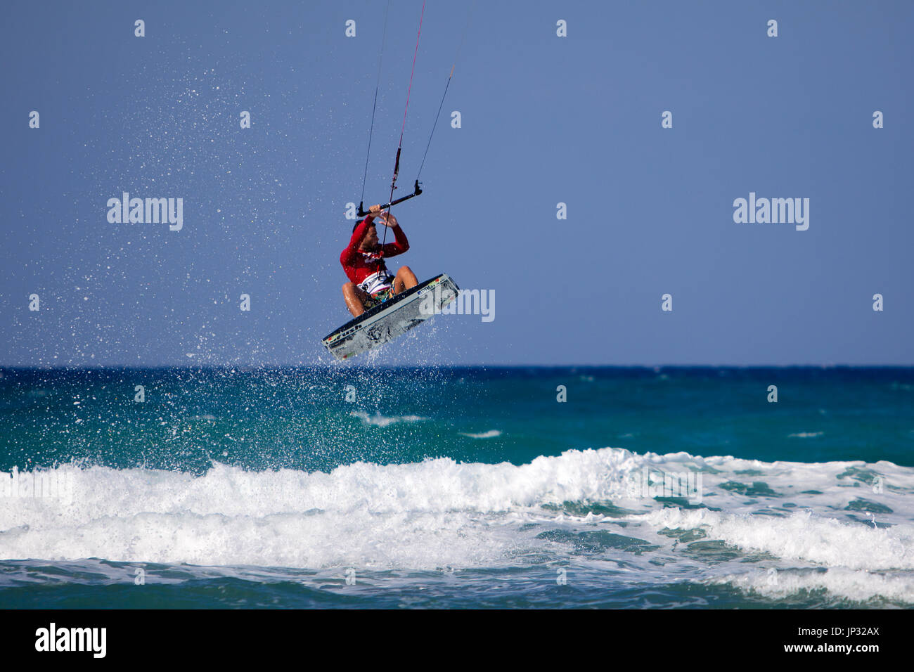 Europe, Greece, Kreta - a kitesurfer jumping in the waves Stock Photo