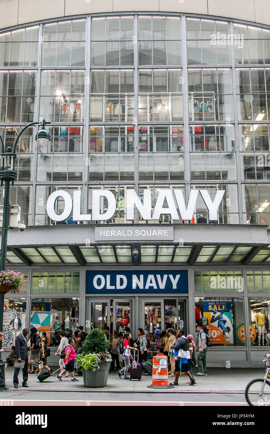 People walk by an Old Navy store in Manhattan. Stock Photo