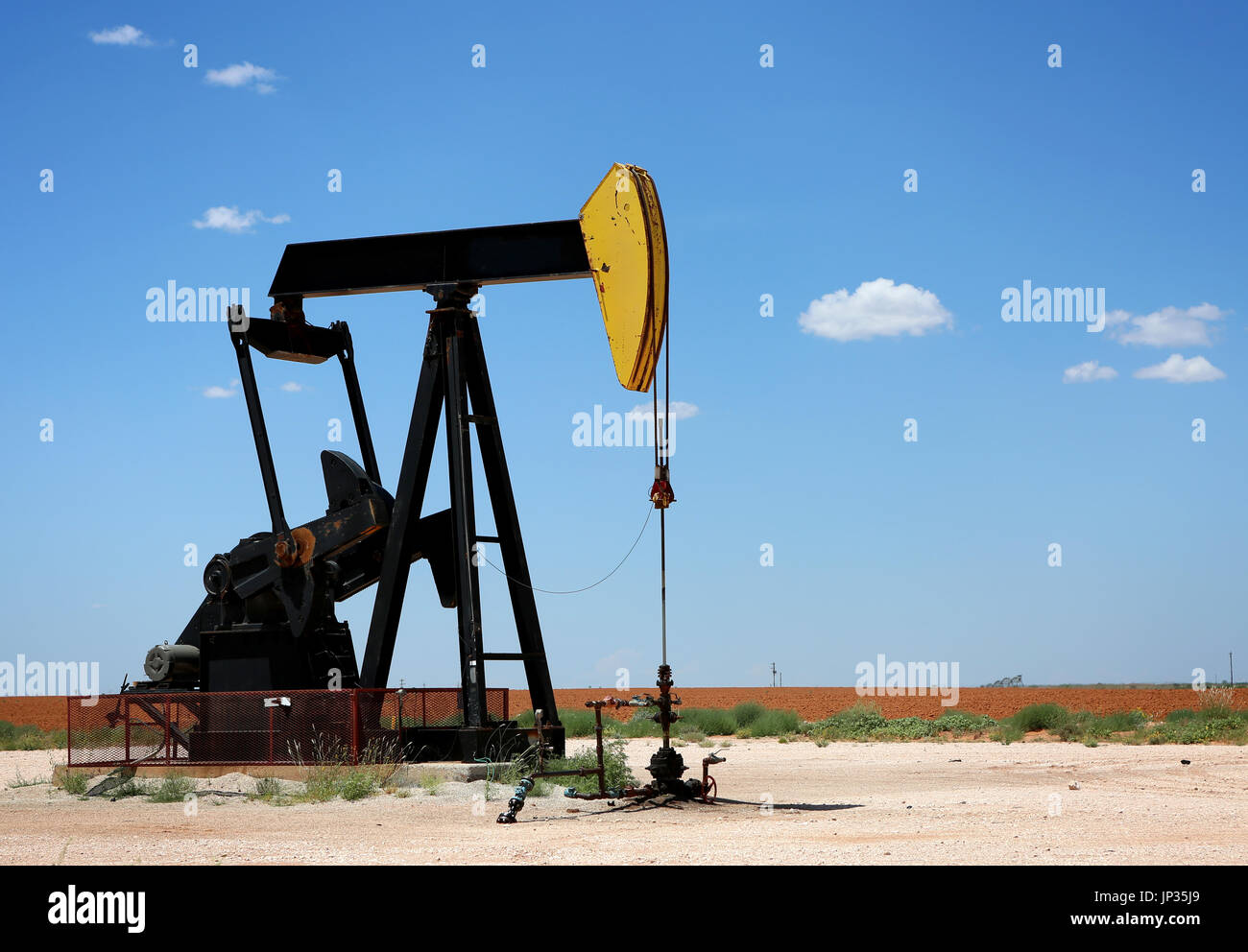 Oil Pump on the field. Oil industry equipment Stock Photo