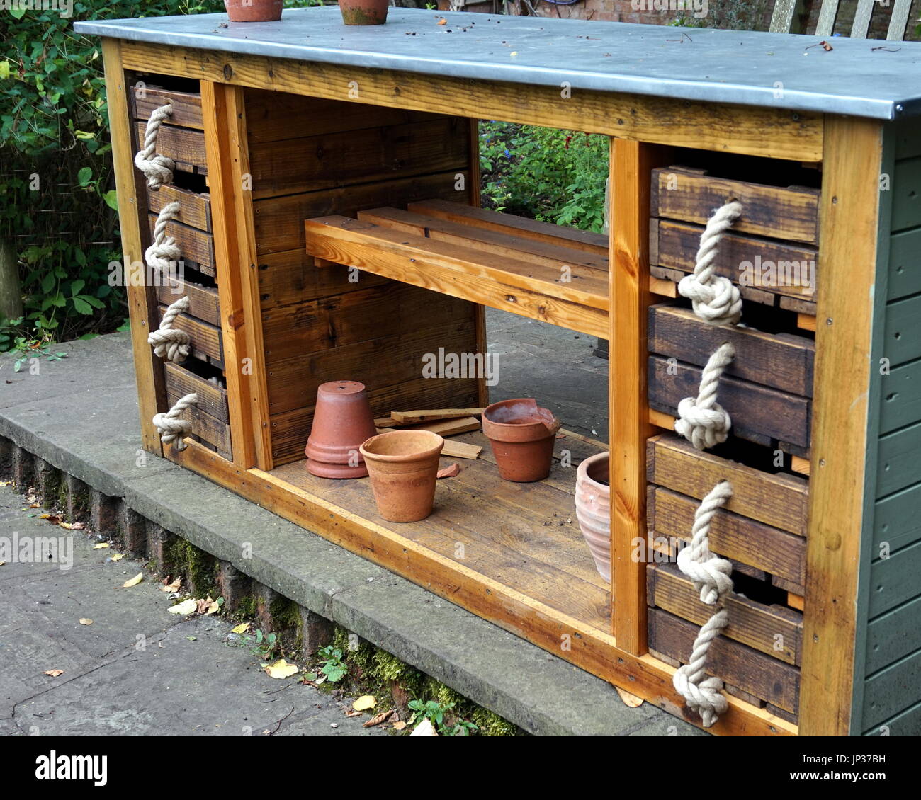 Unique and unusual garden storage unit with drawer handles made from