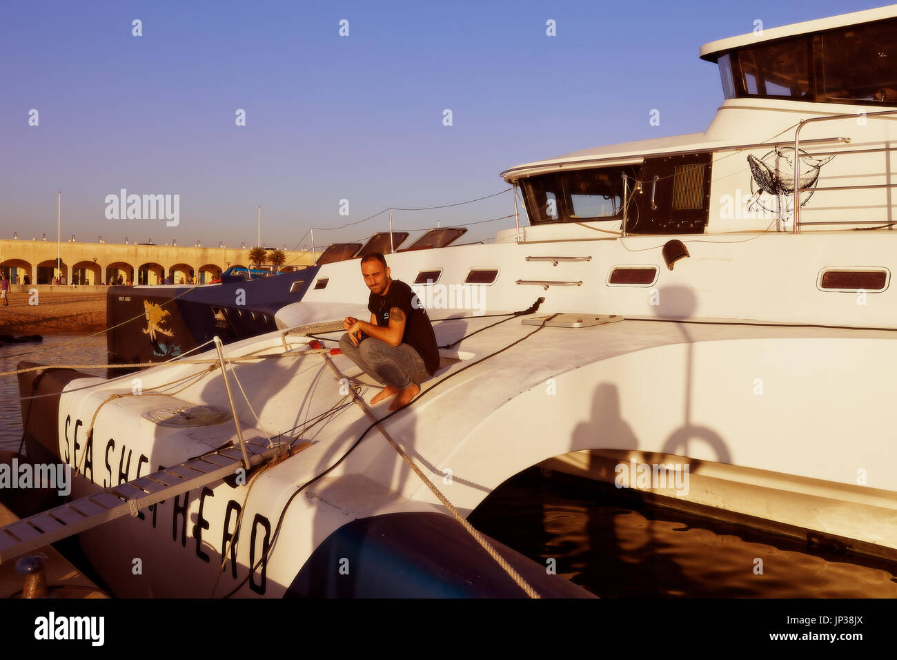 OSTIA, LAZIO, ITALY - OCTOBER 18, 2014: The trimaran of Sea Shepherd Brigitte Bardot docks in the port of Ostia. Stock Photo