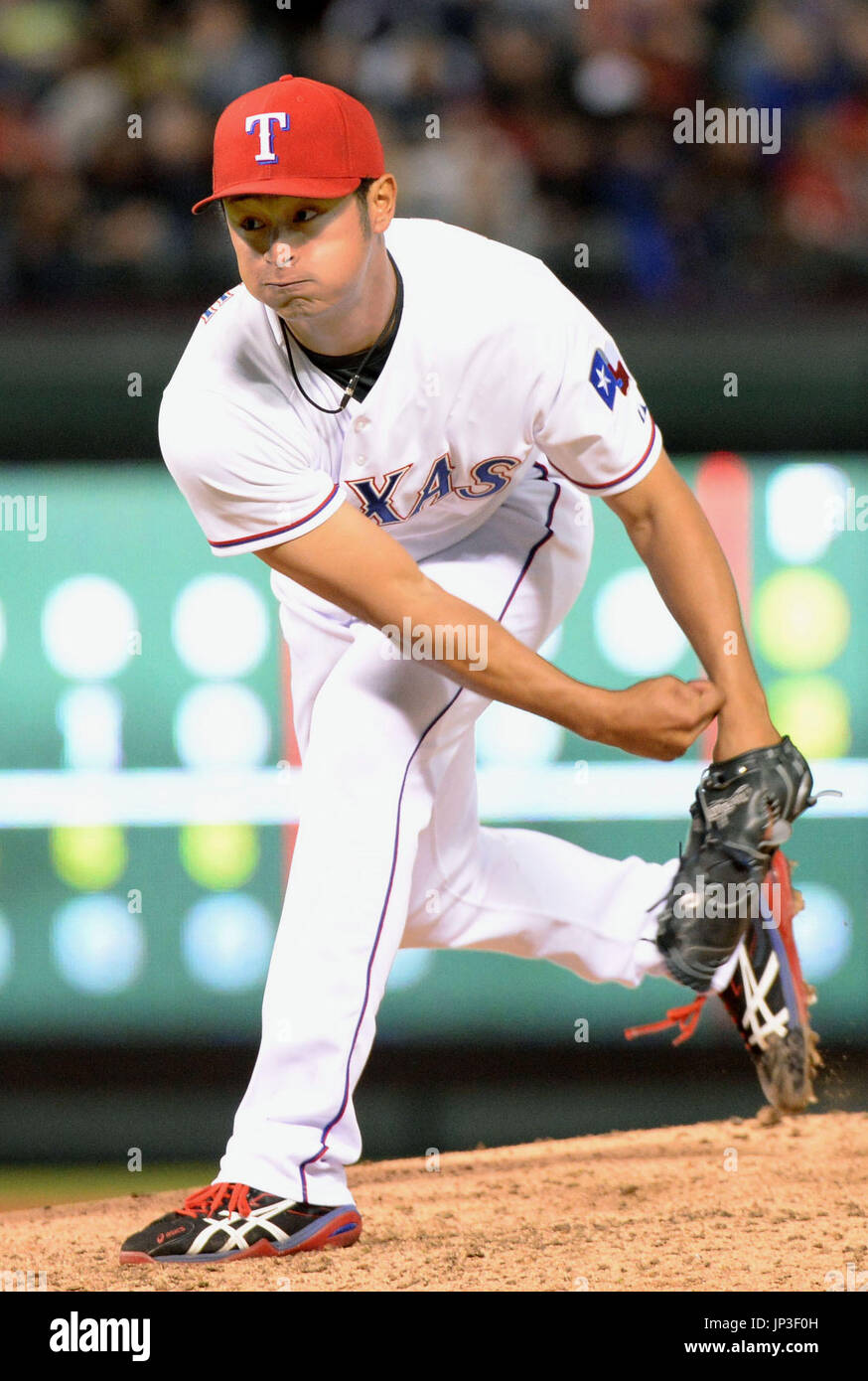 ARLINGTON, United States - Texas Rangers starter Yu Darvish pitches against the Seattle Mariners at Globe Life Park in Arlington, Texas, on April 16, 2014. Darvish allowed two runs in seven innings on seven hits and two walks. The Rangers won 3-2. (Kyodo) Stock Photo