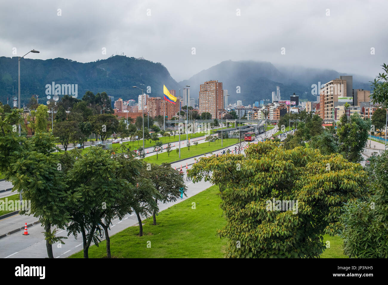 Looking over towards the city down one of the main avenues into central Bogota. On Sundays they are closed to vehicles, only bicycle and foot traffic. Stock Photo