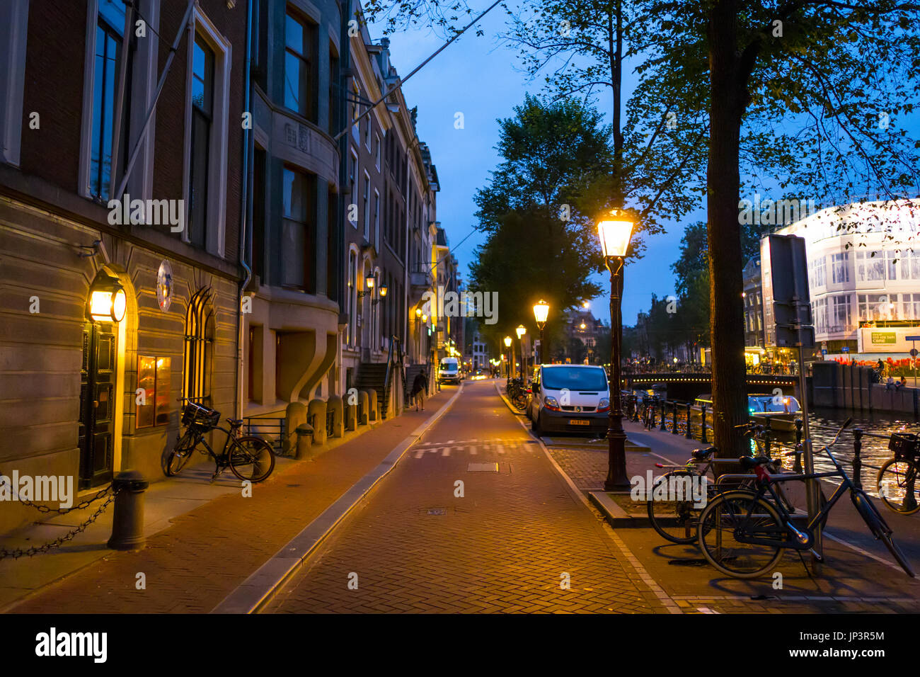 The Sidewalks at the the canals of Amsterdam by night - AMSTERDAM - NETHERLANDS Stock Photo