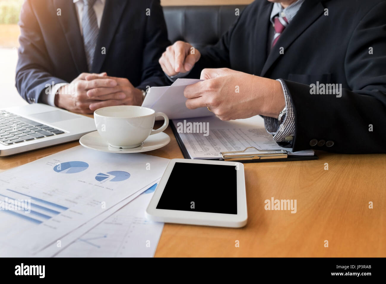 Team work process young business managers crew working with new startup project ,discussting and analyse graph plans Stock Photo