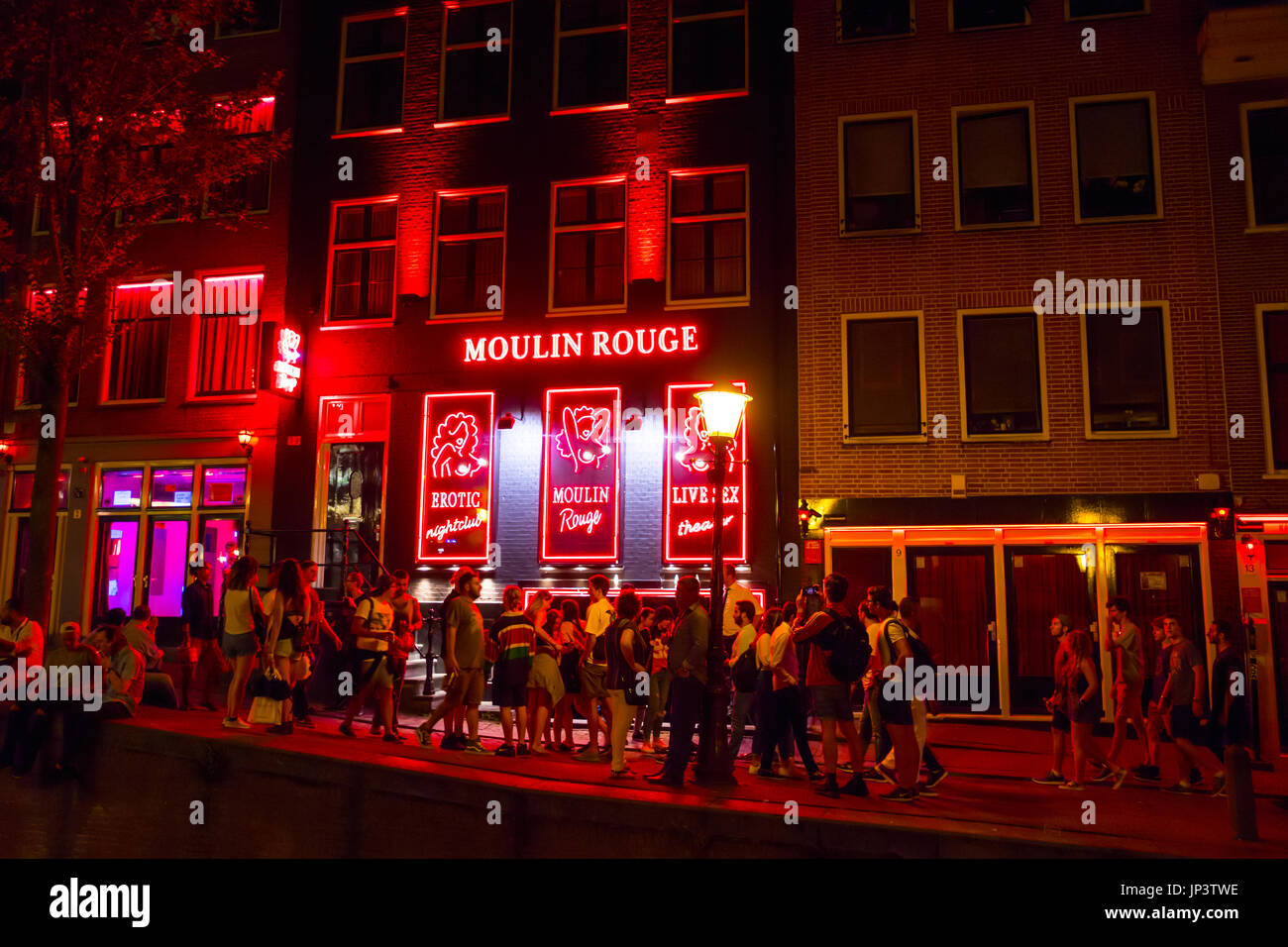 The colorful illuminated buildings in the Red Light District of Amsterdam -  AMSTERDAM - NETHERLANDS Stock Photo - Alamy