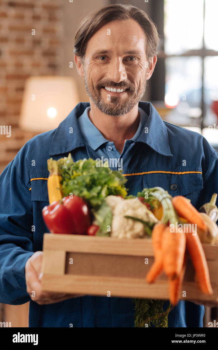 Portrait of enthusiastic courier in action Stock Photo