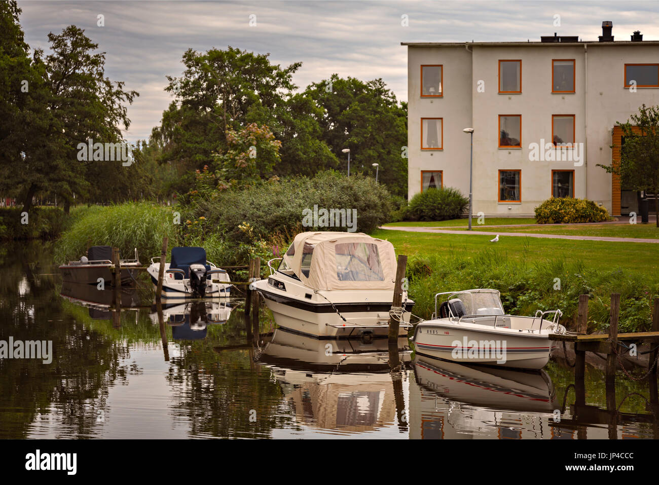 KUNGSBACKA, SWEDEN - July 21, 2017. Boats and apartment blocks by the river. Stock Photo