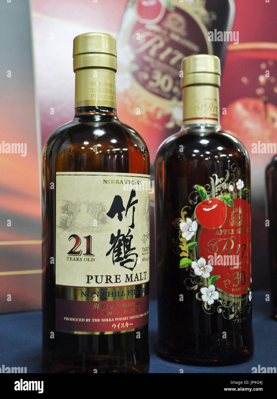 TOKYO, Japan - Nikka Whisky Distilling Co. releases special versions of whisky (L) and brandy to commemorate the 80th anniversary of the firm's establishment in Tokyo on July 2, 2014. (Kyodo) Stock Photo