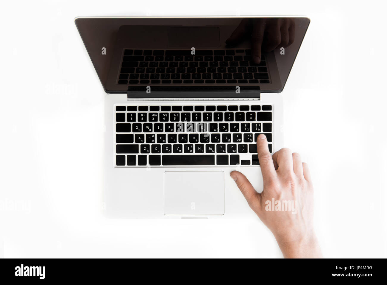 top view of human hand typing on laptop computer isolated on white, wireless communication concept Stock Photo