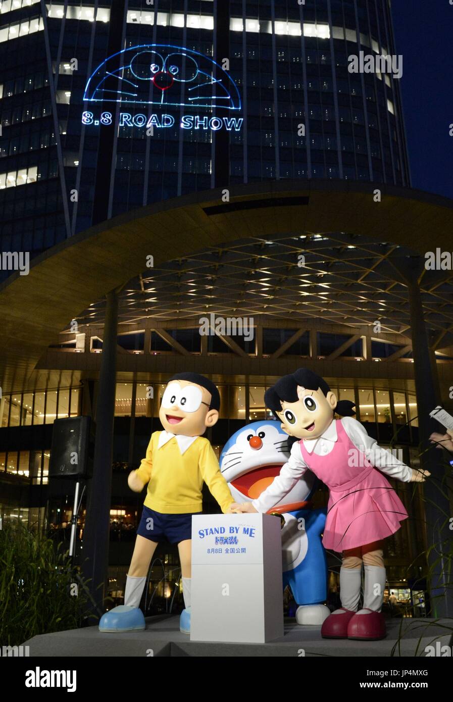 TOKYO, Japan - Characters from the Doraemon cartoon and anime series  jointly switch on in a ceremony to draw the face of Doraemon with laser  beams on the exterior of 52-story, 247-meter