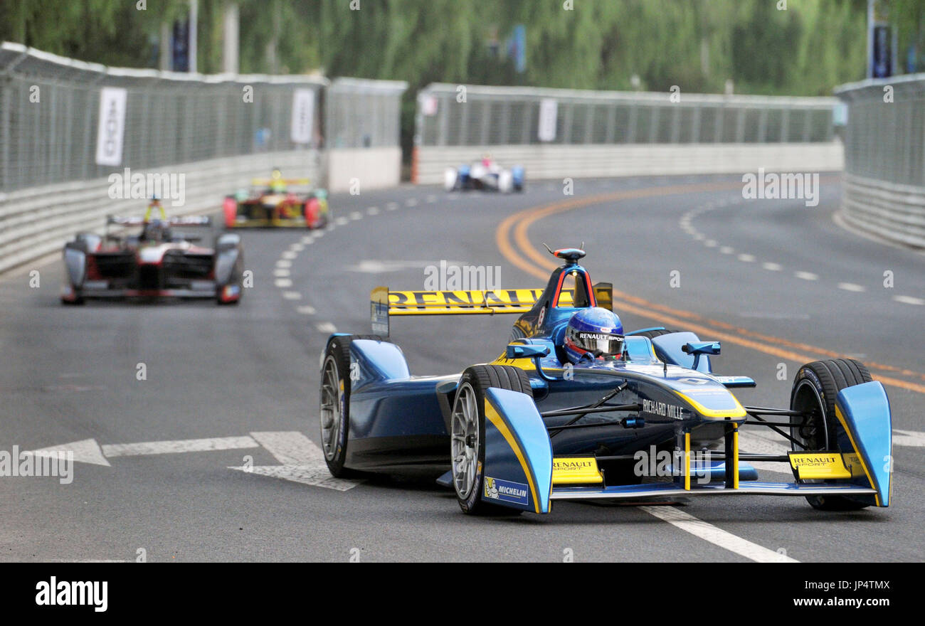 BEIJING, China - Racing cars compete during the Formula E all-electric ...