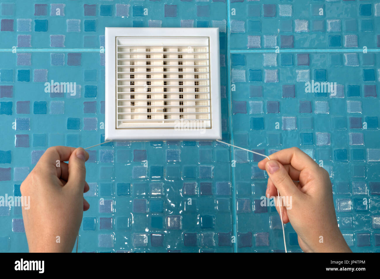 https://c8.alamy.com/comp/JP4TPM/close-up-wall-ventilation-grille-with-pull-cord-air-flow-control-hand-JP4TPM.jpg