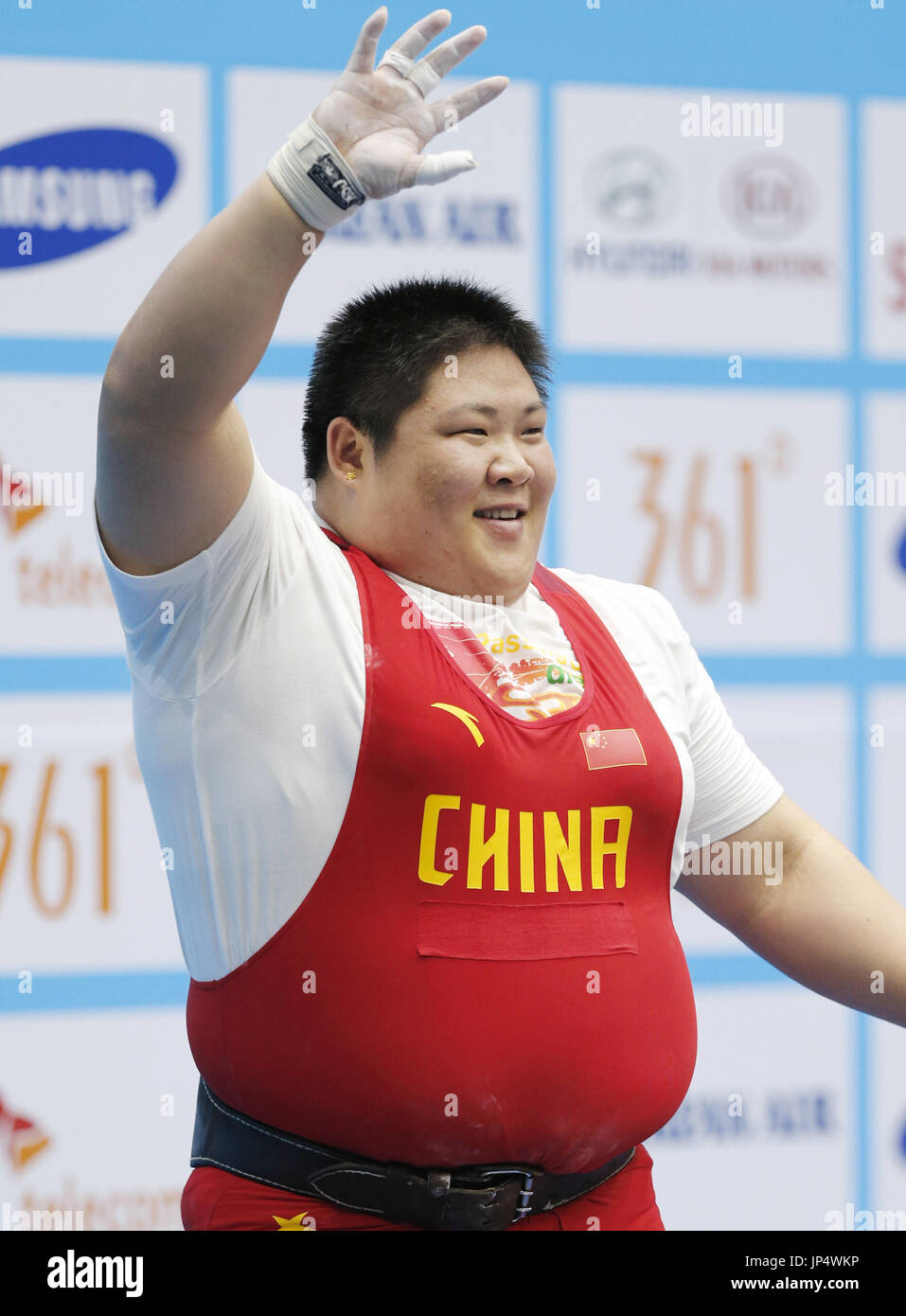 INCHEON, South Korea - Chinese weightlifter Zhou Lulu acknowledges  spectators after lifting 192 kilograms to set a world record in the women's  over-75kg class at the Asian Games in Incheon, South Korea,