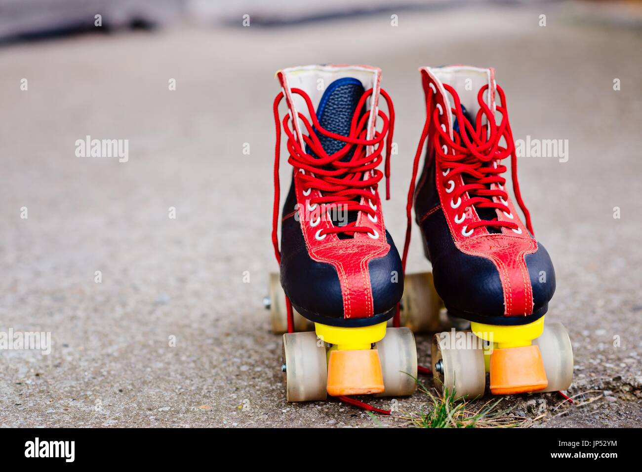 Old fashioned black and red roller skates Stock Photo - Alamy