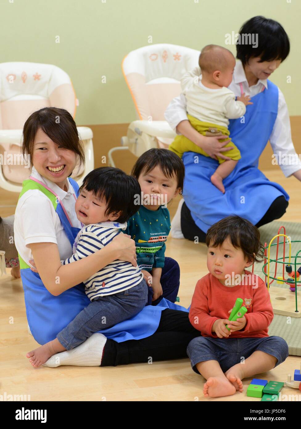 TOKYO, Japan - Small children play in a nursery room opened at the ...