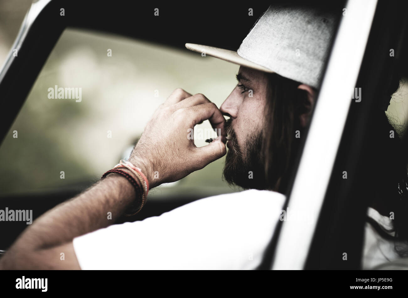 Bearded young man in a baseball cap hi-res stock photography and images ...