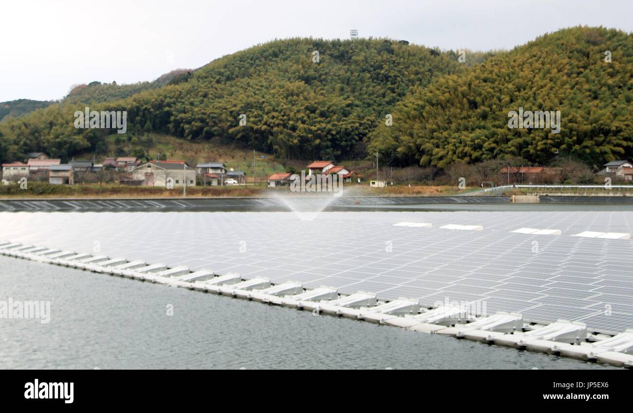 MATSUE, Japan - A mega solar power system floats on the water in Yasugi ...