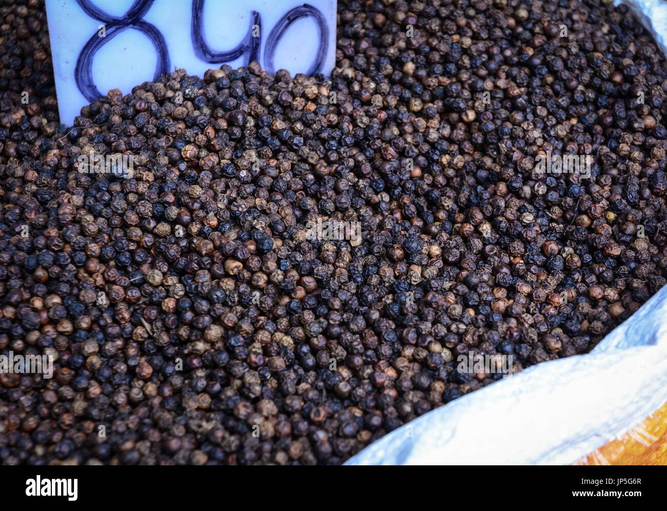 Black peppers at Chandni Chowk Market in Old Delhi, India. The Chandni