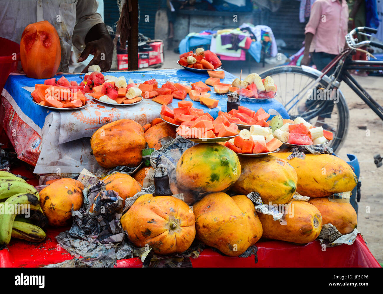 Selling fresh fruits at street market in Old Delhi, India. Delhi is
