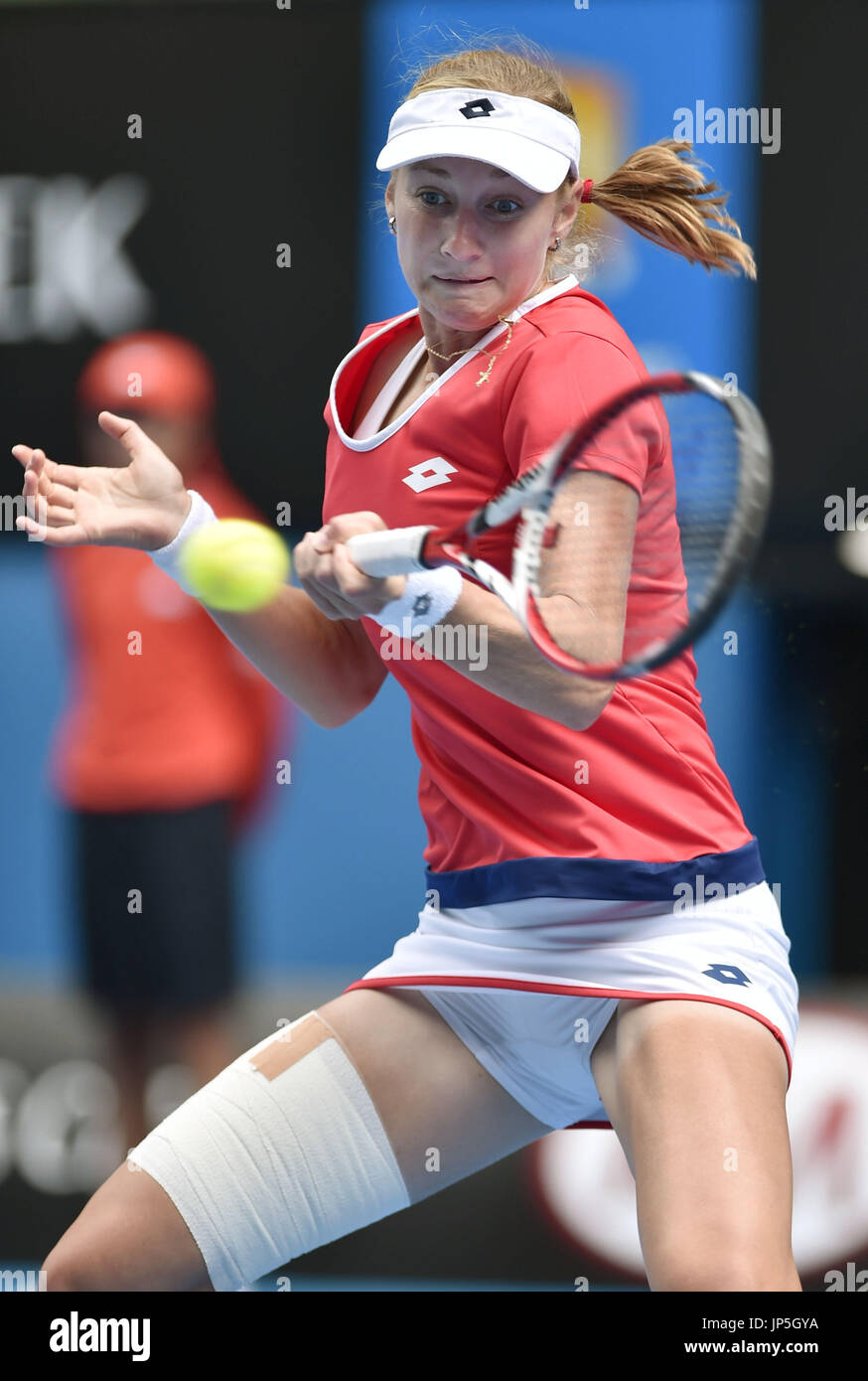 Russia's Ekaterina Makarova makes a forehand return to Simona Halep of