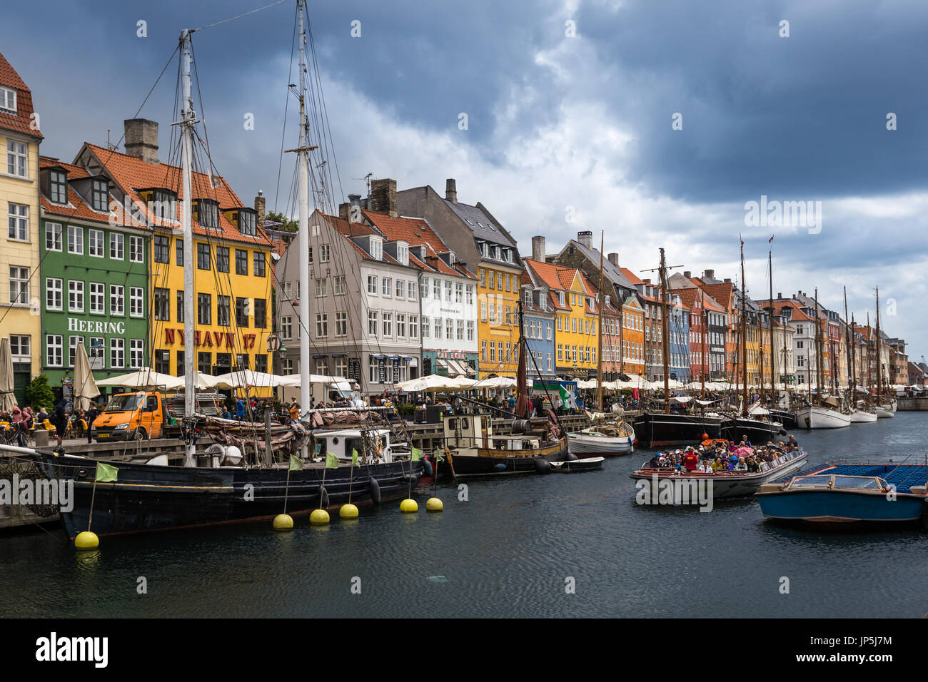 Copenhagen, Denmark - June 16, 2017: Nyhavn Pier with color Buildings and Ships Stock Photo