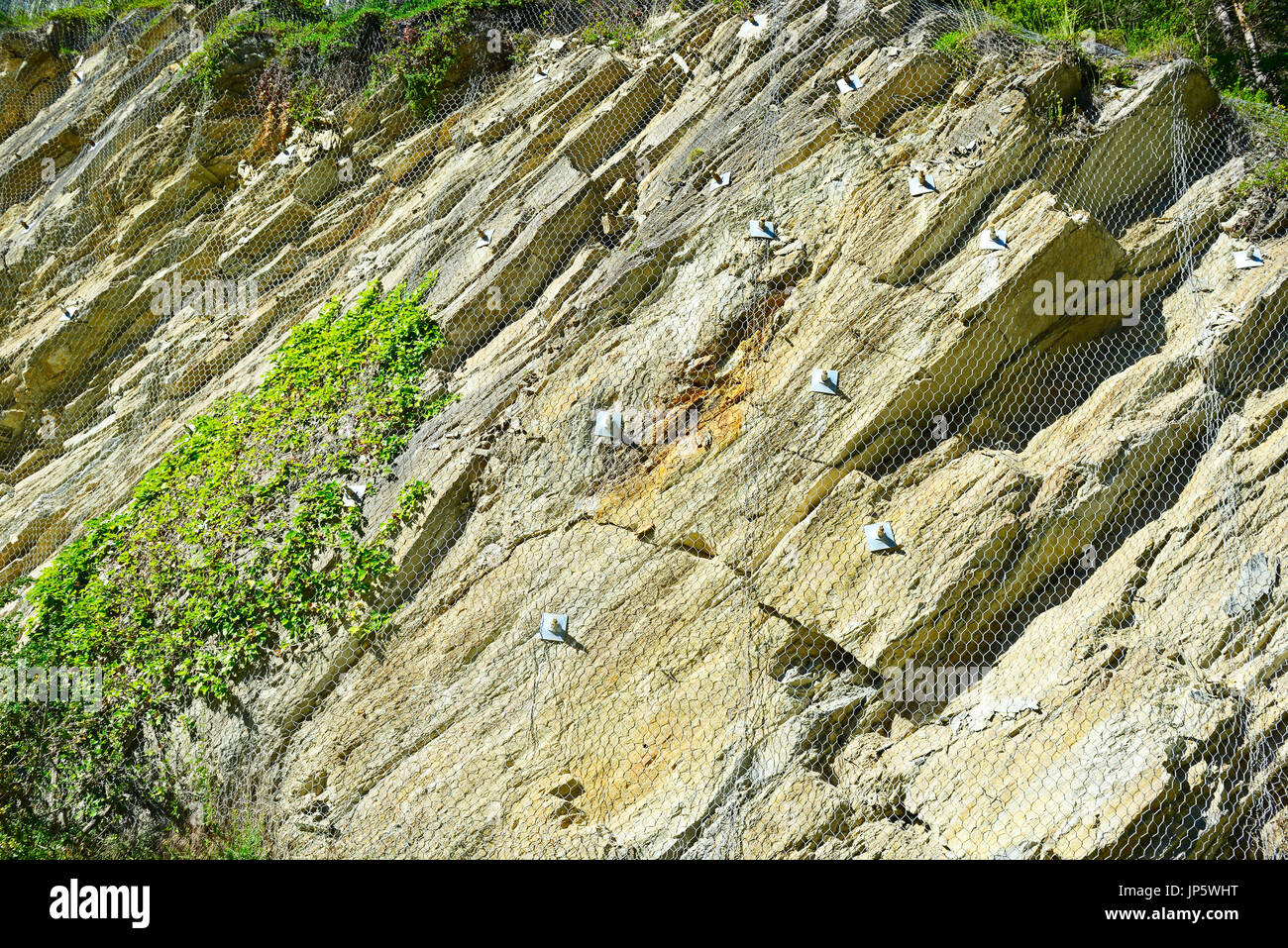 Safety net of rockfall in the mountains Stock Photo