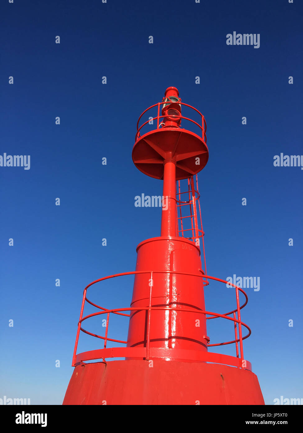 Red Lighthouse inside at port with blue sky Stock Photo Alamy