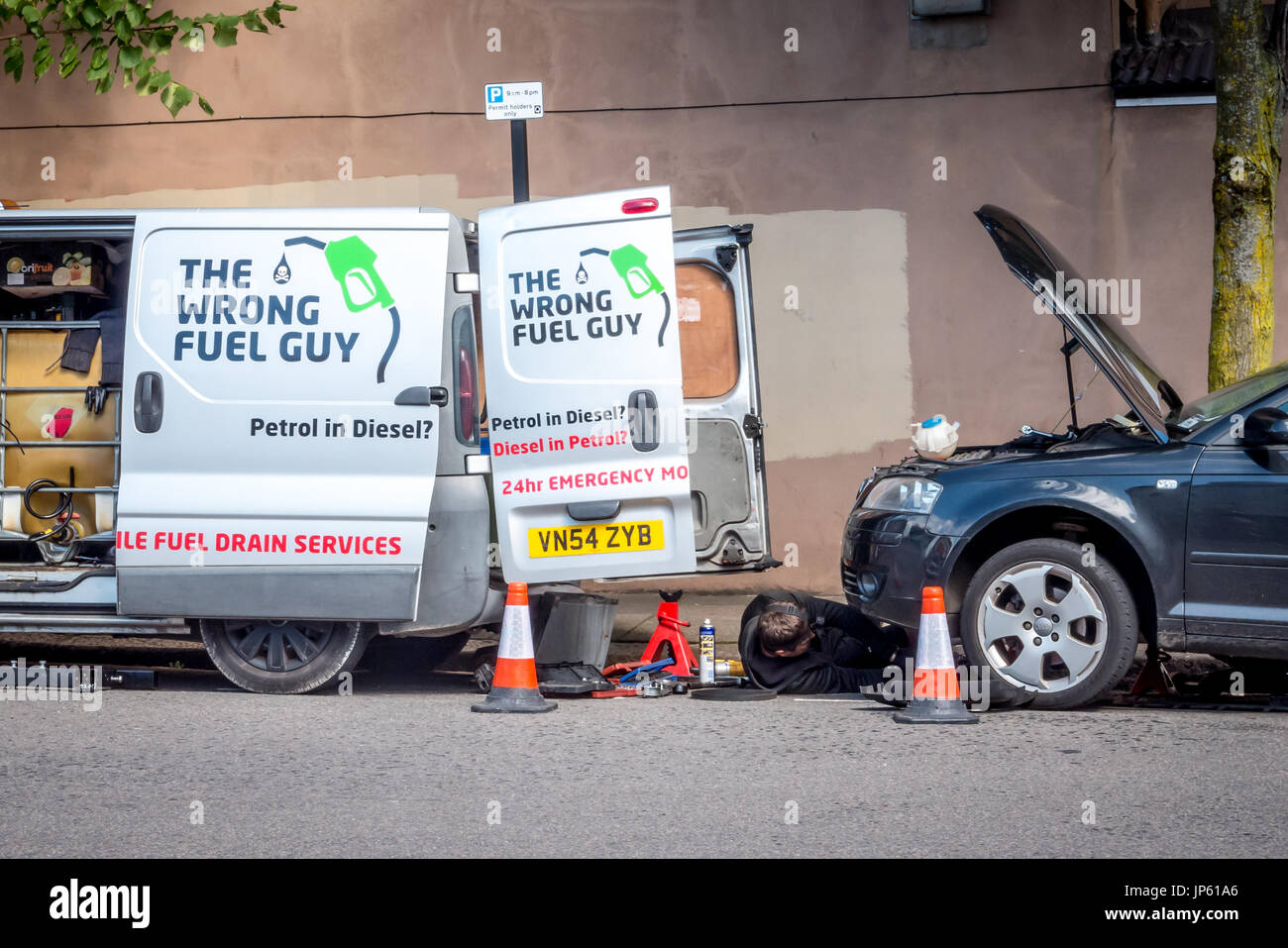 Repairing a car filled with the wrong fuel Stock Photo Alamy