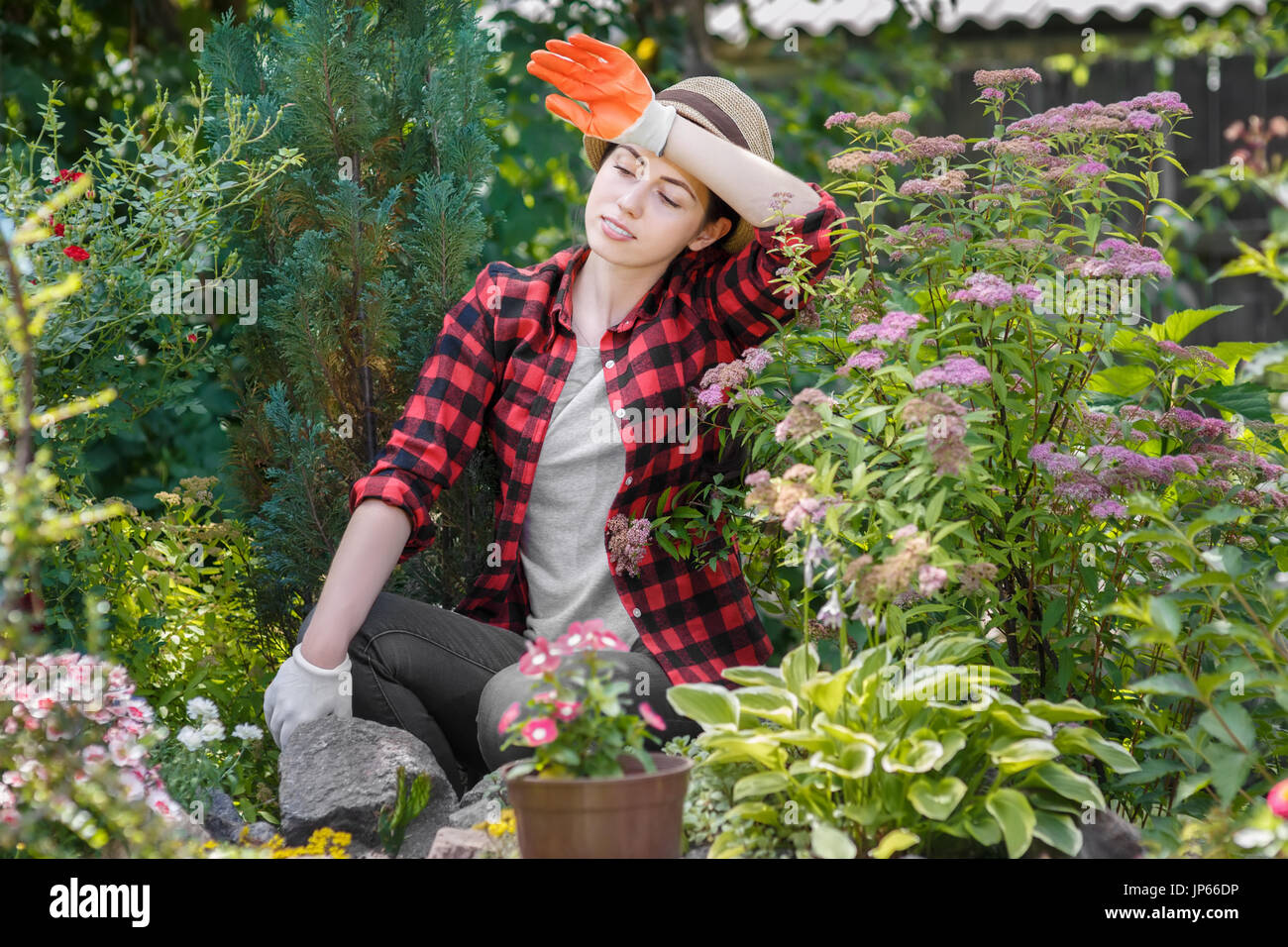 tired young woman gardener Stock Photo